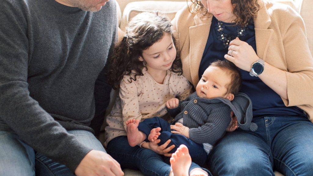 close up of Jay, Charlotte, Thomas and Erin Barreto family. eflects on years of infertility, resilience, healing and the joy of welcoming two children through IVF.