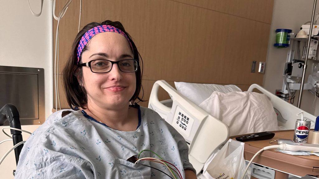 Callie Jones, a social worker for Mayo Clinic Health System (MCHS) in Mankato, Minnesota, in hospital bed, complications related to her baclofen pump