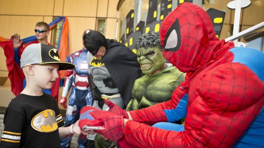 Carter Simonson in 2014 visited by superheroes while a patient at Mayo Clinic Children's