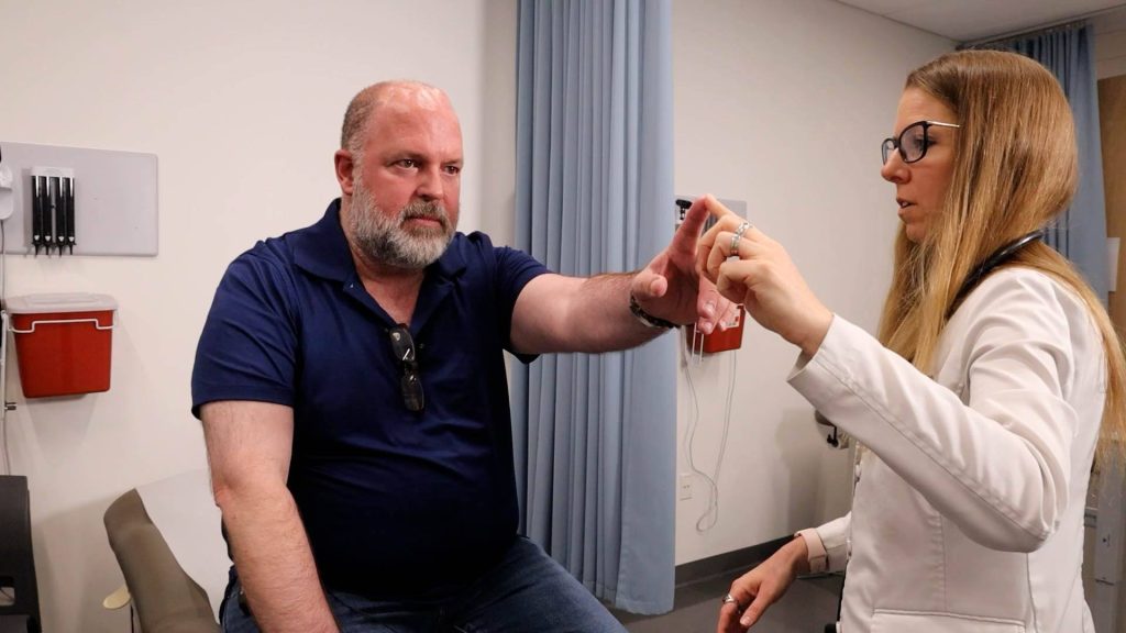 Chris Sams with Dr. Marie Grill, neuro exam, for valley fever