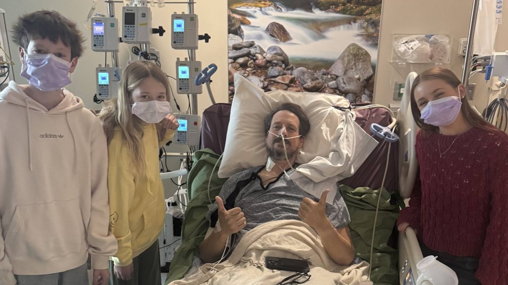 Curtis with his children following his successful liver transplant, due to his rare cancer.