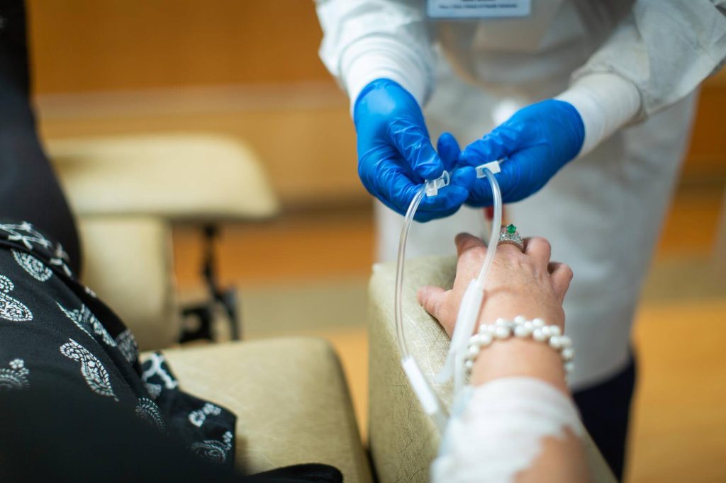 chemotherapy drug being administered intravenously by a nurse