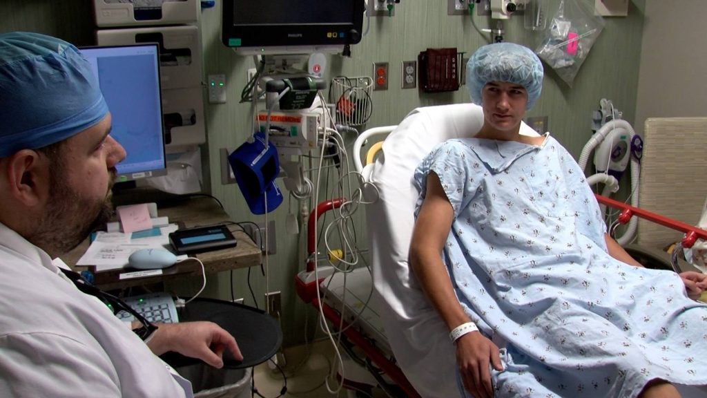 Dr. Emmanouil Grigoriou meets with Roman Solheim before surgery