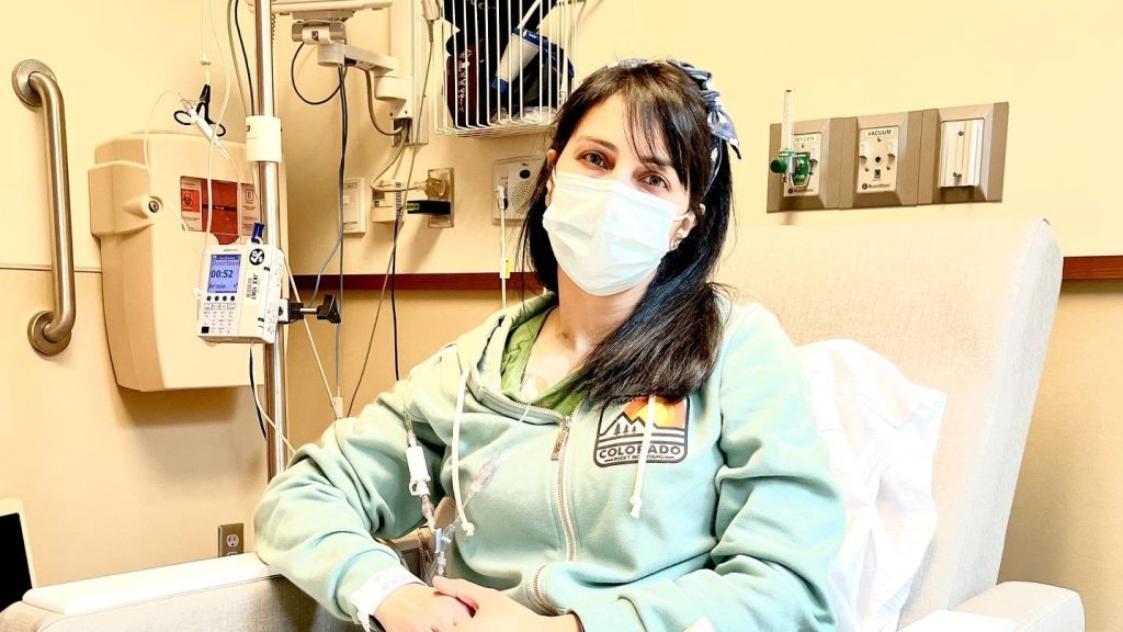 Photo of Ann Alaboud in a hospital bed, as she's treated for stomach cancer