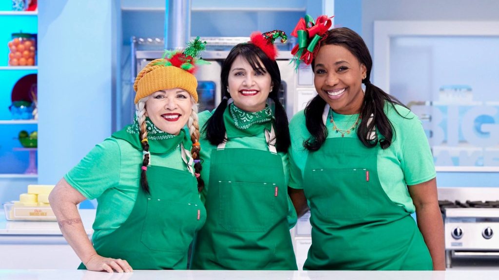 Photo of Ann Alaboud (middle) with contestants on Cake Wars.