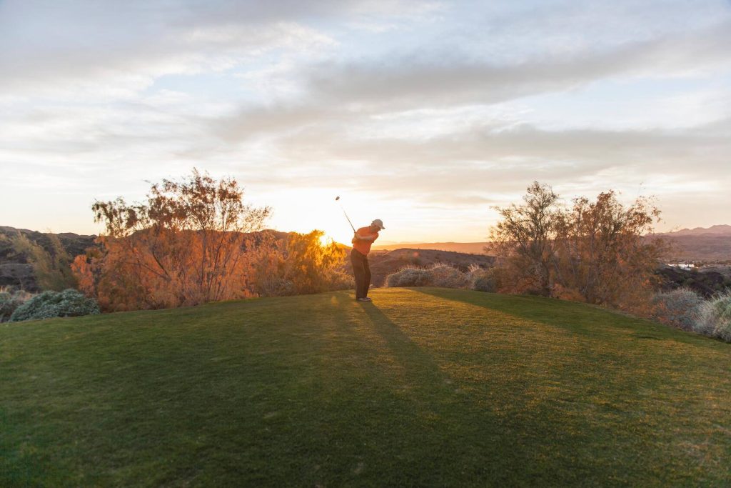A man taking a shot on a golf course