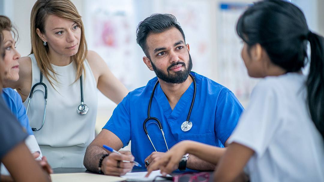 Care provider listening, holding pen