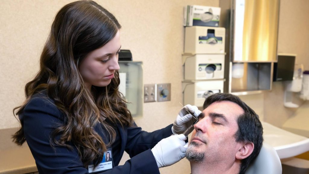 Sara Hutchinson, nurse practitioner, cares for a patient in the Plastic Surgery Cleft and Craniofacial Clinic at Mayo Clinic in Rochester.