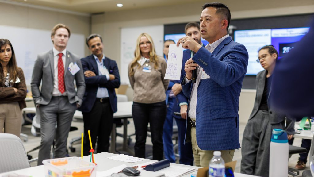Participants working on medical innovations during the Biodesign Innovation Workshop.