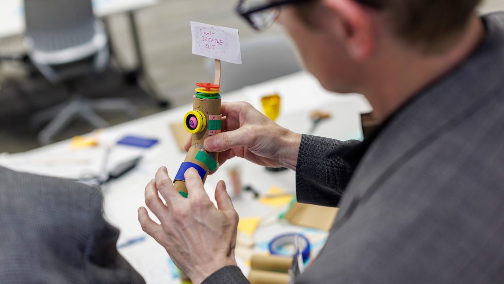 Participants working on medical innovations during the Biodesign Innovation Workshop. 