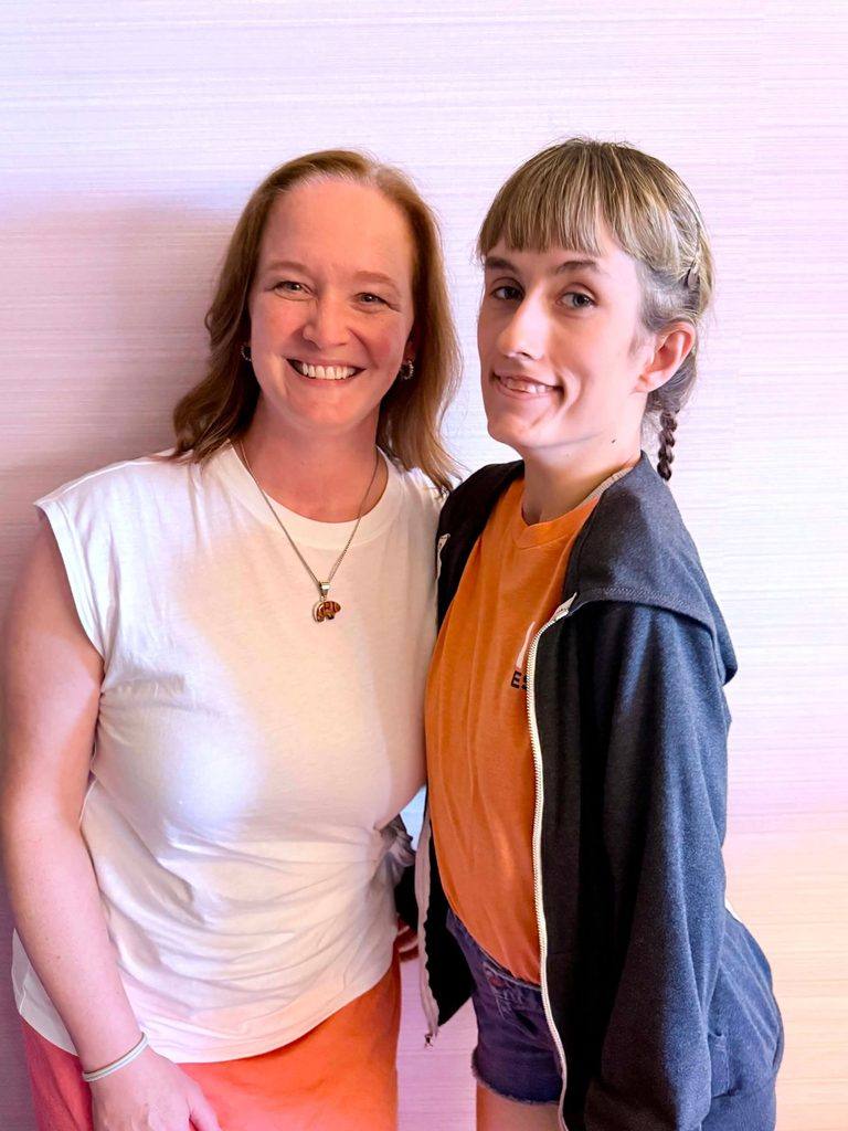 Margot Cousin, Ph.D., left, with Summer Negele at a KCNK9 symposium in Dallas.