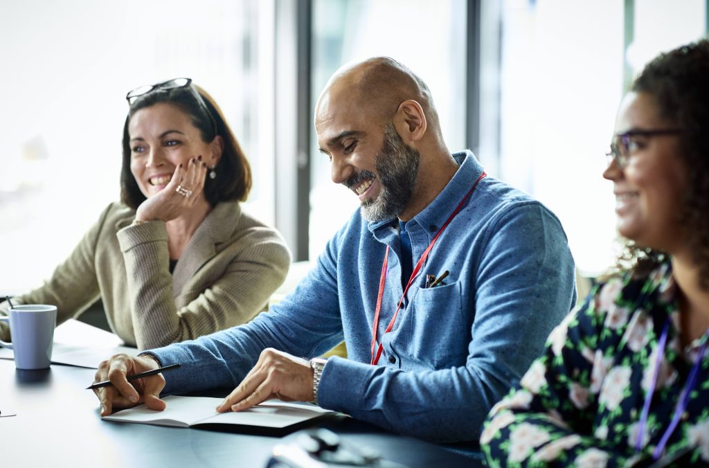 Smiling mature businessman during meeting in modern office