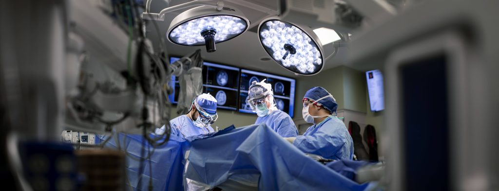Ian Parney, MD, PhD, Neurosurgery consultant, during surgery in the operating room.