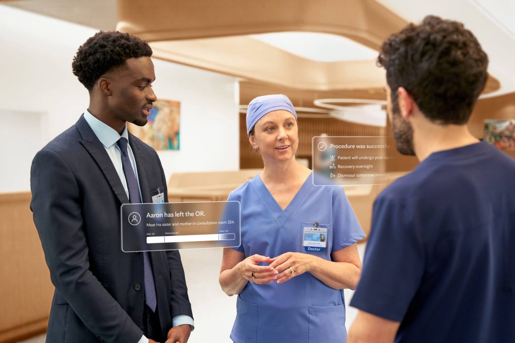 Surgeon in scrubs speaks with two care team members in a hospital, with digital overlays showing a successful procedure and patient status updates.