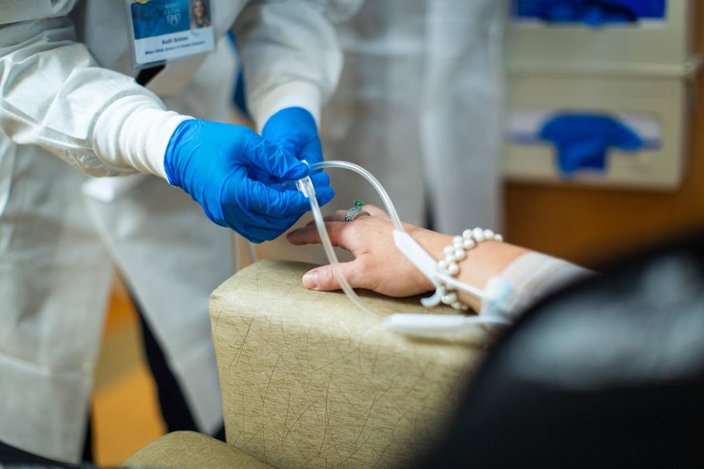 chemotherapy drug being administered intravenously by a nurse