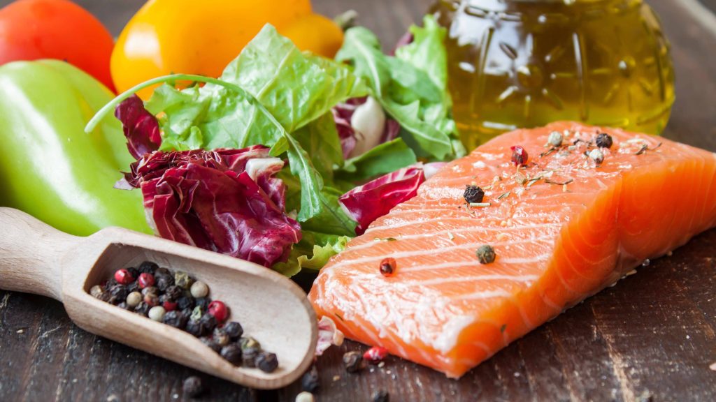 a sample mediterranean diet with fish, nuts, fruits and vegetables
